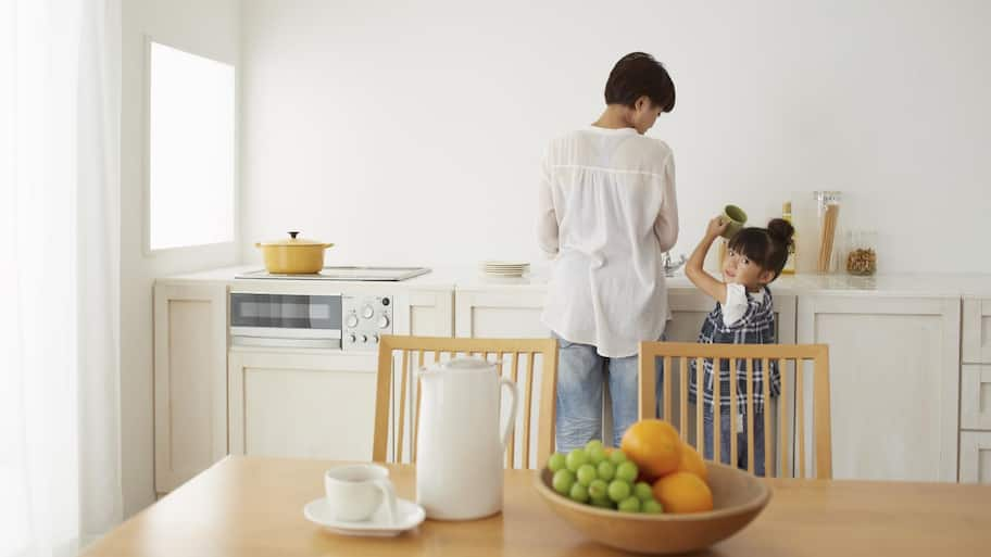 Mother cooking with her daughter 