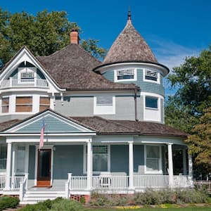 A blue victorian style house