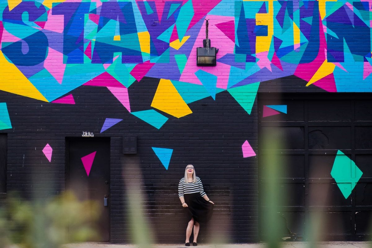 Christine Tremoulet in front of the Stay Fun wall in Austin, Texas