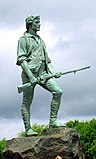 Foto des „Lexington Minuteman“. Die Status stellt Captain John Parker dar, wurde von Henry Hudson Kitson geschaffen und wurde 1900 aufgestellt.