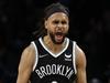 NEW YORK, NEW YORK - DECEMBER 14: Patty Mills #8 of the Brooklyn Nets reacts after making a three-pointer during the second half against the Toronto Raptors at Barclays Center on December 14, 2021 in the Brooklyn borough of New York City. The Nets won 131-129. NOTE TO USER: User expressly acknowledges and agrees that, by downloading and or using this photograph, User is consenting to the terms and conditions of the Getty Images License Agreement.   Sarah Stier/Getty Images/AFP == FOR NEWSPAPERS, INTERNET, TELCOS & TELEVISION USE ONLY ==