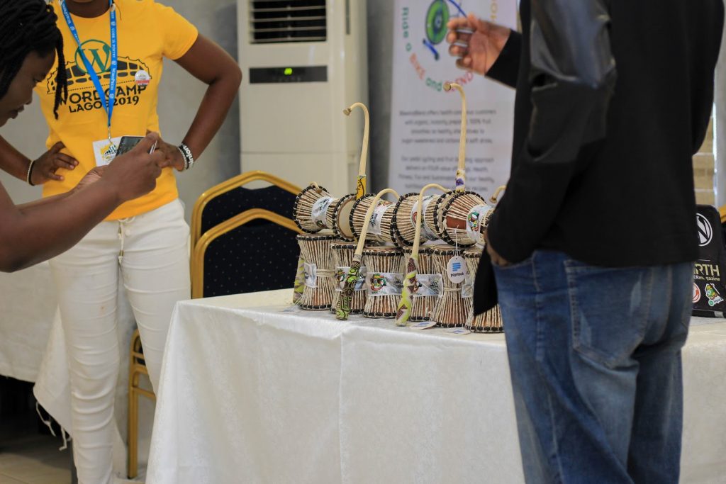 For the speakers gift, we made Omele drum which can also be used as a gangan, with the drumstick wrapped in local fabric and the drum itself branded with our first Lagos Wapuu, Ayantero.