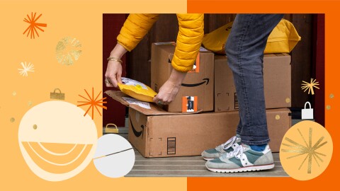 An image of a person in an orange coat bending down to pick up a package in a pile of Amazon packages on their doorstep.