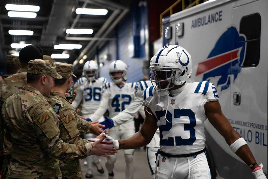 Airmen greet members of the NFL’s Indianapolis Colts