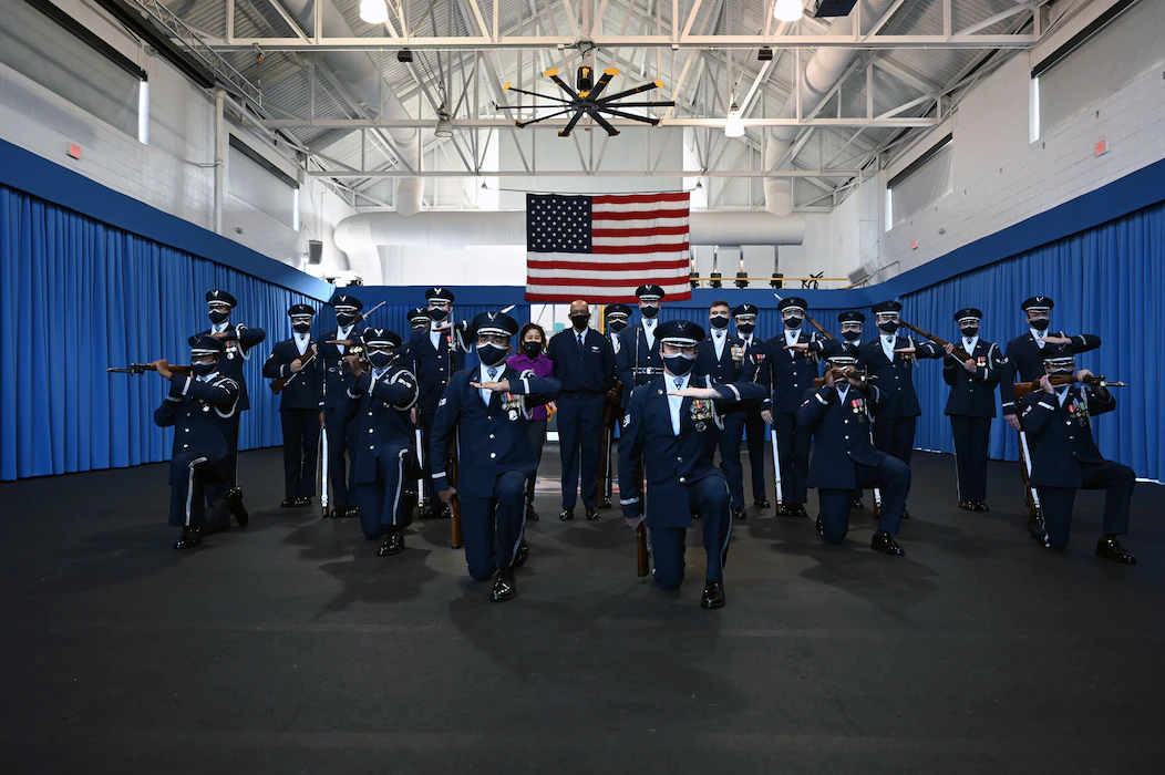 Gen. CQ Brown, Jr. and his wife, Sharene, pose with the U.S. Air Force Honor Guard Drill Team