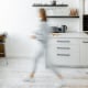 Kitchen with blurred human figure