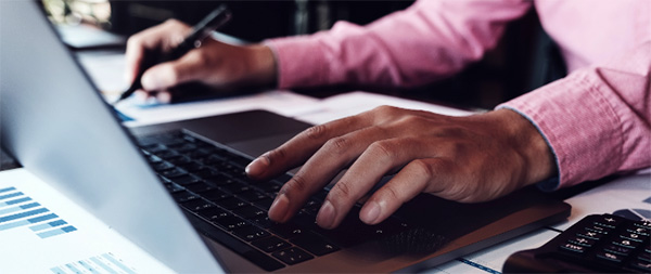 close-up of person using laptop computer