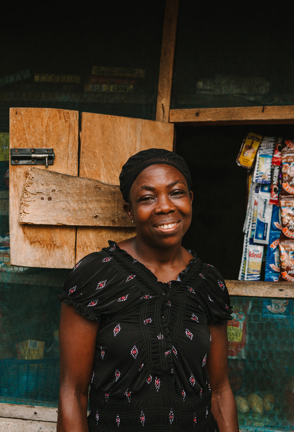 Model of Hope program volunteer Rebecca posing outside her shop.