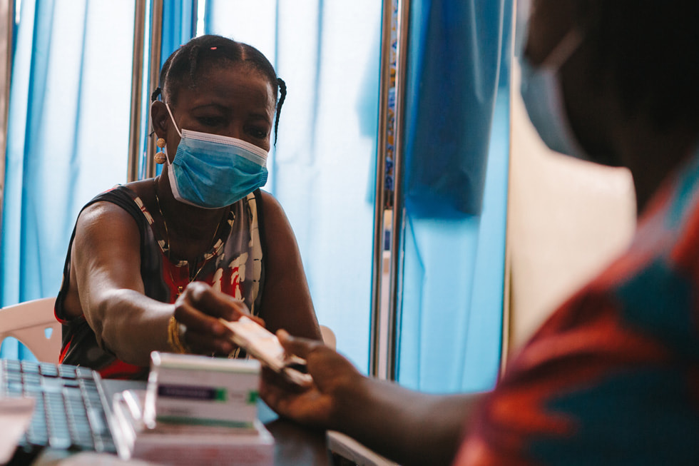 A female patient getting her antiretroviral therapy medication from St. Martin de Porres Hospital.