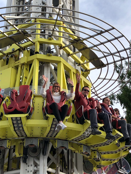 A man and a woman on a amusment park ride coaster