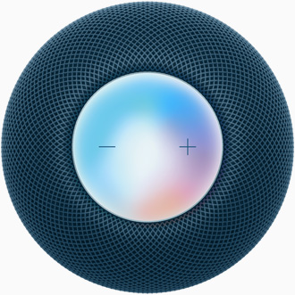 Un HomePod mini blu visto dall’alto con i controlli più e meno per alzare e abbassare il volume sulla superficie touch colorata.