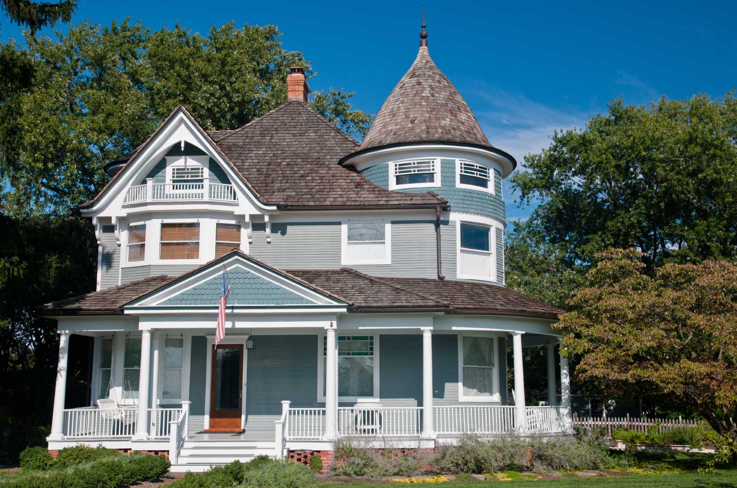 A blue victorian style house