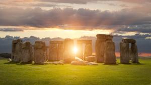 The Sun shining through the Stonehenge ancient monument.