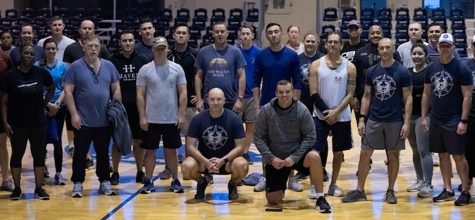 Students and instructors from the Leadership Development Course pose for a photo after their valor workout on Dec. 8, 2021, Maxwell Air Force Base, Alabama. The workout honored the memory of those who were killed in the Rooster 73 crash. (U.S. Air Force photo by Airman 1st Class Cody Gandy)