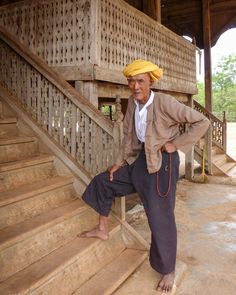 A PaO man in a village in the Kalaw region of Myanmar pauses on the wooden steps of the village temple. He wears a traditional turban and loose indigo-dyed pants. In his hand he has prayer beads to help in reciting Buddhist sutras. #VanishingAsia #Kalaw #Myanmar Wooden Steps, Prayer Beads, Turban, Temple, Indigo, Asia, Traditional, How To Wear, Pants