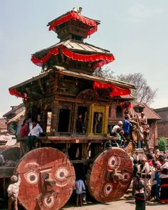 A tiny gold deity sits atop this large wooden chariot which is pulled by ropes through the streets of Kathmandu Nepal. Photo from my book #VanishingAsia #kathmandu #nepal Ropes, Image Shows, Deities, Nepal, Asia, Scene, Book, Book Illustrations, Books