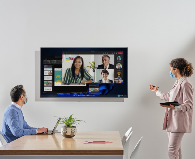 Workers attend a video conference