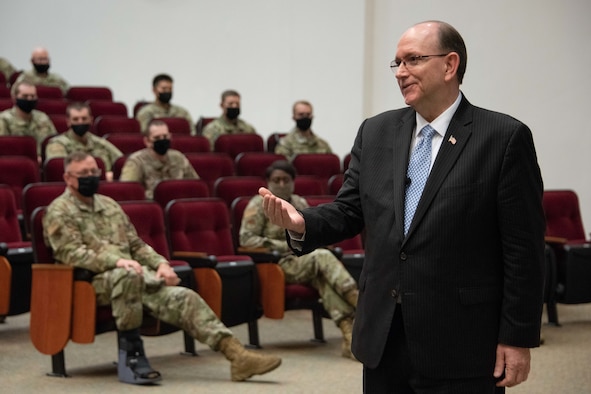 Matthew Donovan, Under Secretary of Defense for Personnel and Readiness, speaks to officer trainees in the Officer Training School auditorium.