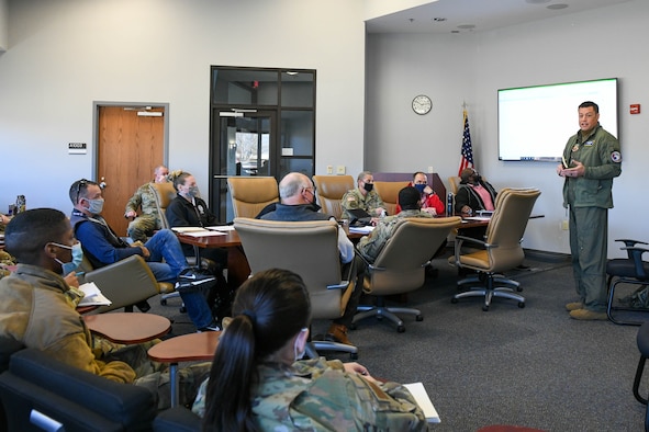 U.S. Air Force Lt. Col. Dustin Ripley, Emergency Preparedness Liaison Officer (EPLO) to Arkansas, briefs members of the 97th Air Mobility Wing and the Federal Emergency Management Agency on Altus Air Force Base, Oklahoma, Dec. 16, 2021. FEMA’s mission is helping people before, during and after disasters. (U.S. Air Force photo by Airman 1st Class Trenton Jancze)