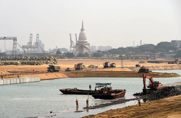 Construction vehicles work on a land reclamation project in Colombo, Sri Lanka.