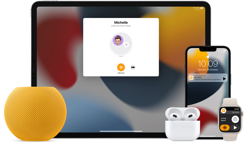 Yellow HomePod mini, an iPad, AirPods in a case, an iPhone and an Apple Watch with a pink strap are arranged.