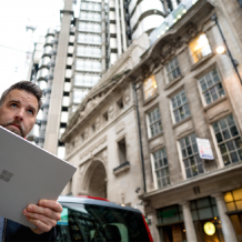 Man outside on laptop