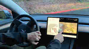 Tesla disables video games on center touch screens in moving cars