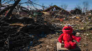 Searchers digging through mountains of debris left by deadly tornadoes in Kentucky 