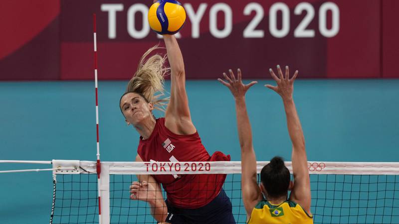 United States' Andrea Drews, above, spikes as Brazil's Gabriel Braga Guimaraes defends during...