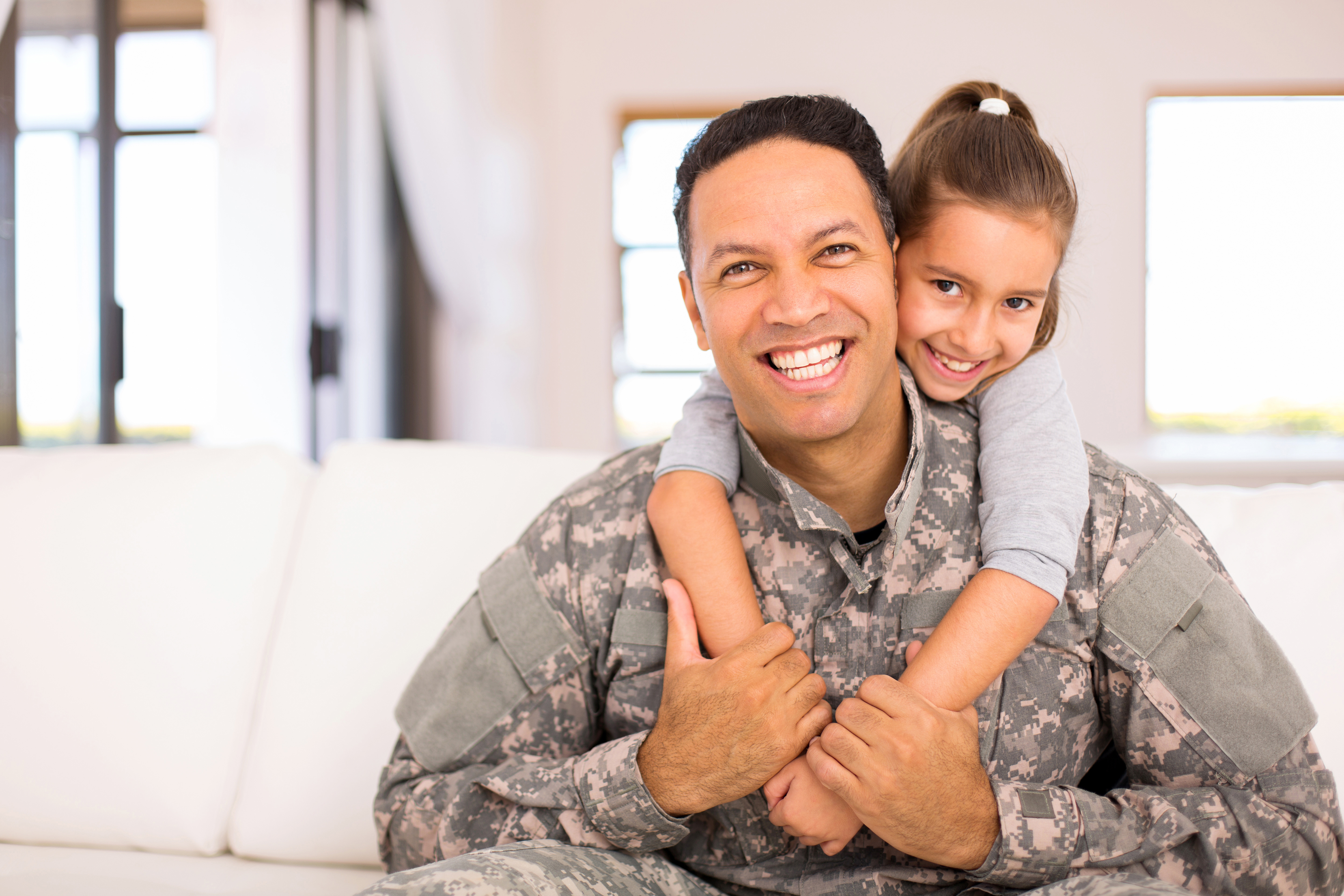 Military dad with child