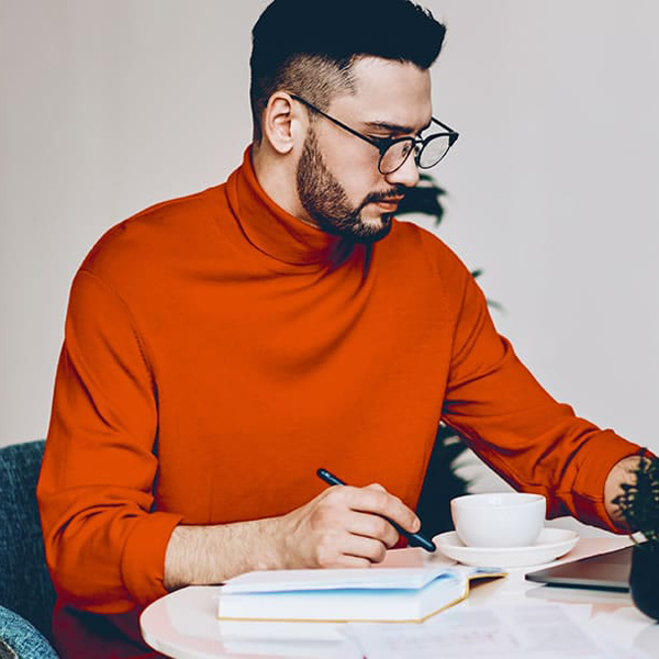 Photo of a man using a laptop