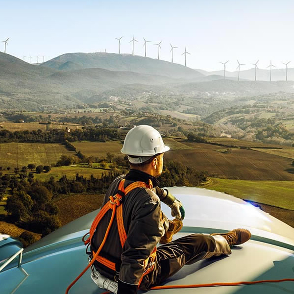 Worker on top of a windmill