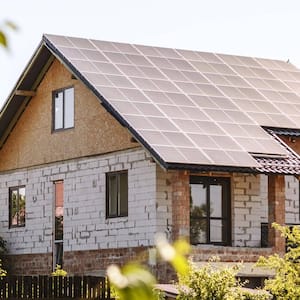 A suburban house with solar panels on the roof