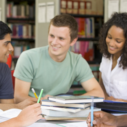 students around table in a library