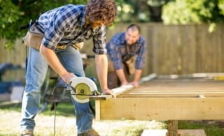 two professional deck builders at work