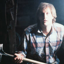 A film still from "Arachnophobia" with actor Jeff Daniels holding a shovel.