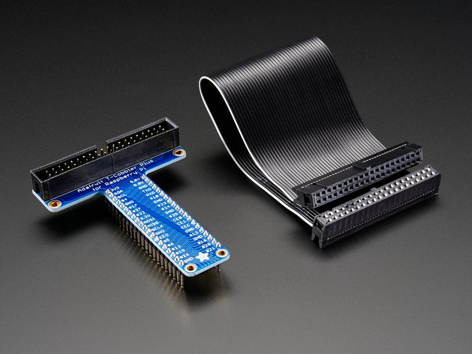 Angled shot of Assembled Pi T-Cobbler Plus next to GPIO ribbon cable