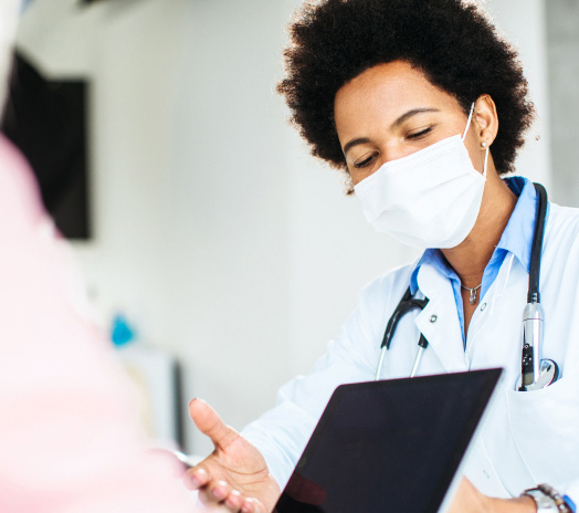 A woman with mask and stethoscope