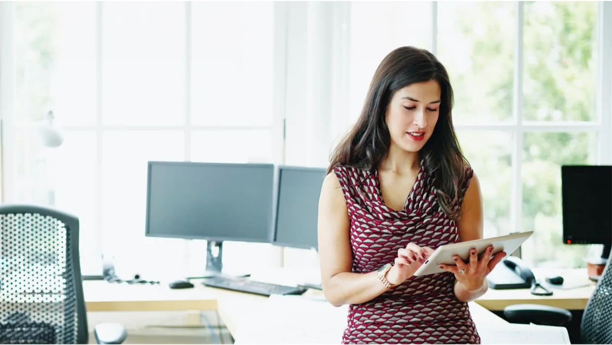 Businesswoman working on digital tablet in an office