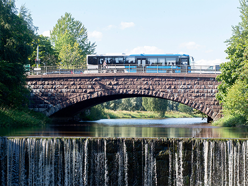 Bus driving over a bridge