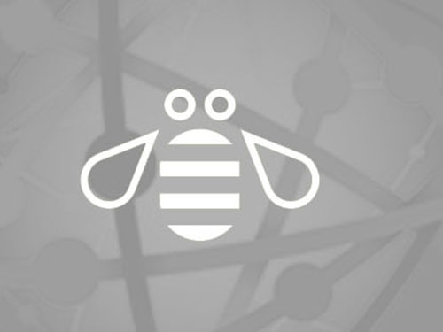 IBM bee on gray background with white globe graphic