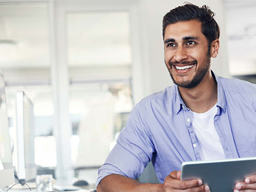 Bearded young man in blue button-down shirt