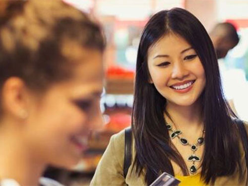 Two women shopping at a grocery store