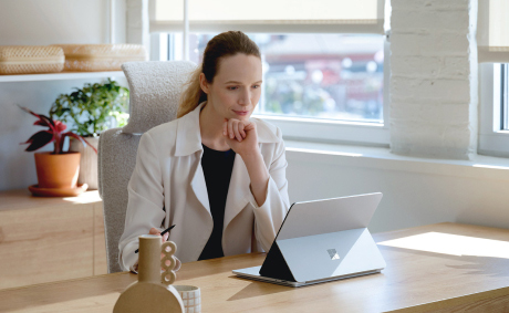 Person in an office using a tablet on a stand