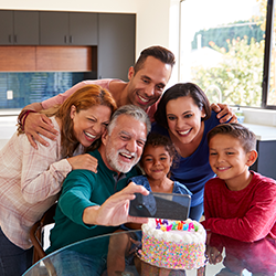 family gathered around birthday cake