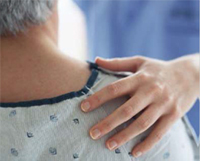 a nurse holding a patient for support