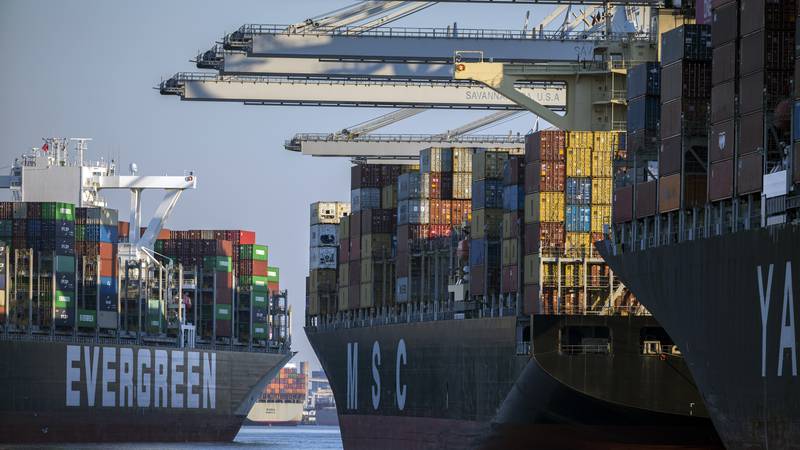 Container ship Ever Far, left, sails down river past the Georgia Ports Authority's Port of...