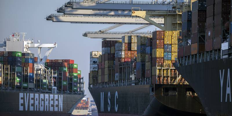 Container ship Ever Far, left, sails down river past the Georgia Ports Authority's Port of...