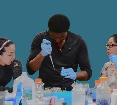 A person holding a pipette and test tube.