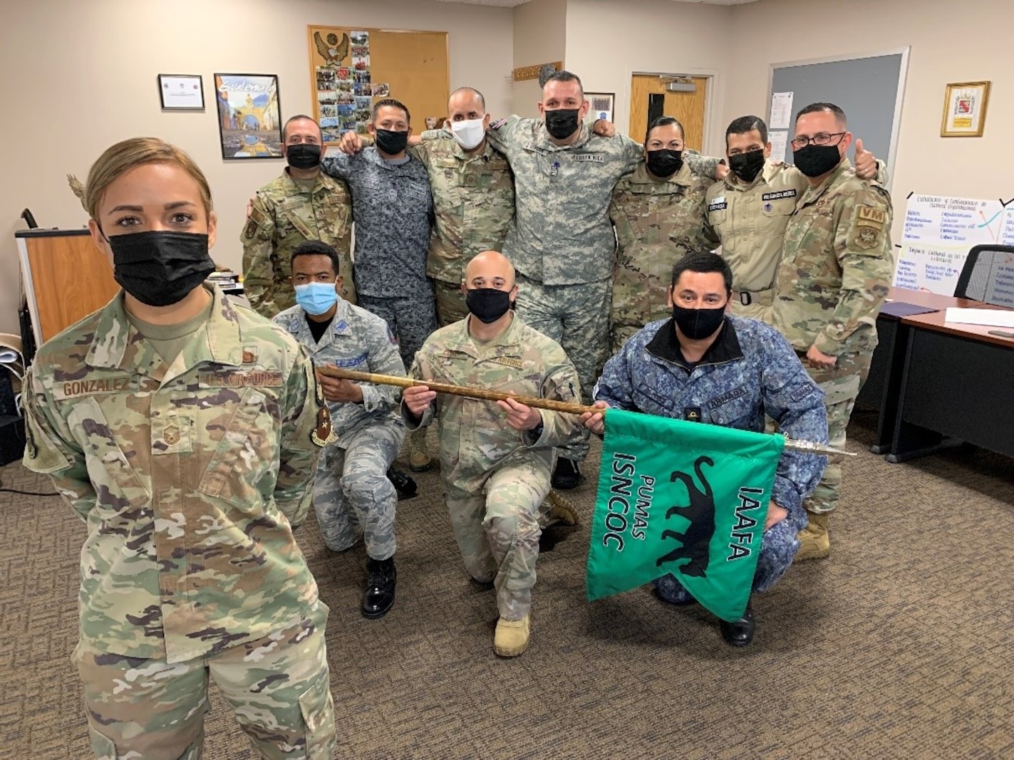 U.S. Air Force Master Sgt. Alfredo Miranda Rosales (far right) and Master Sgt. Carlo Estrada Oquendo (third from left) were the first Language Enabled Airman Program Scholars and among the first U.S. Airmen to attend the new Inter-American Senior Noncommissioned Officer Academy course. The course was implemented in the fall of 2021 to help address partner nation needs. (U.S. Air Force photo by Vanessa R. Adame)